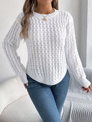 White cable knit sweater with asymmetric hem and crew neck, acrylic material.