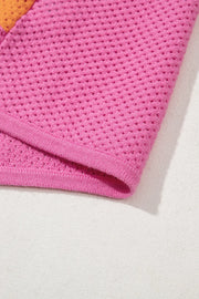 Geometric stripe openwork knit top in multicolor with pink and orange panels and a textured knit.