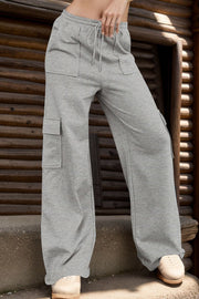 Gray wide-leg cargo lounge trousers with utility pockets and drawstring waist