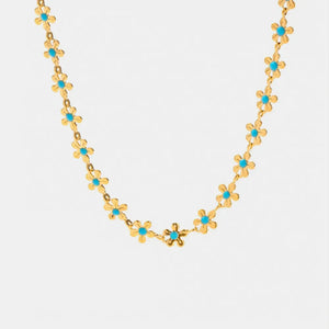 Gold daisy chain enamel petal necklace with turquoise centers