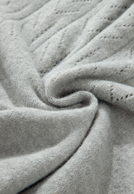 Gray lace-effect knit button-down cardigan with a diamond pattern detail.