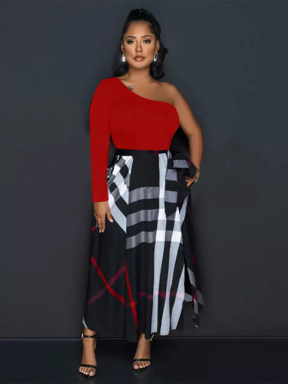 Red one-shoulder midi dress with asymmetrical plaid skirt and waist tie detail.