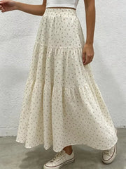 Ruched floral tiered maxi skirt in beige with a gathered waist and flowy silhouette.