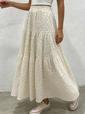 Ruched floral tiered maxi skirt in beige with a gathered waist and flowy silhouette.