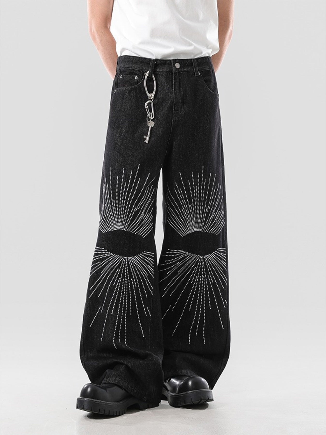 Men's dark wash wide leg jeans with sunburst embroidery and a key chain detail.