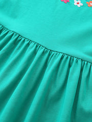 Turquoise A-line dress for kids with floral appliqué detail and gathered skirt.