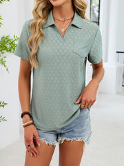 Sage eyelet polo collar blouse with short sleeves and a chest pocket.