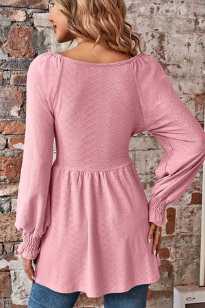 Blush pink textured blouse with shirred sleeves and empire waist