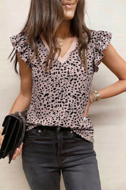 Leopard print polyester blouse with ruffled sleeves and V-neckline.