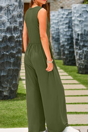 Moss green gathered waist wide leg jumpsuit with sleeveless top and wide legs.