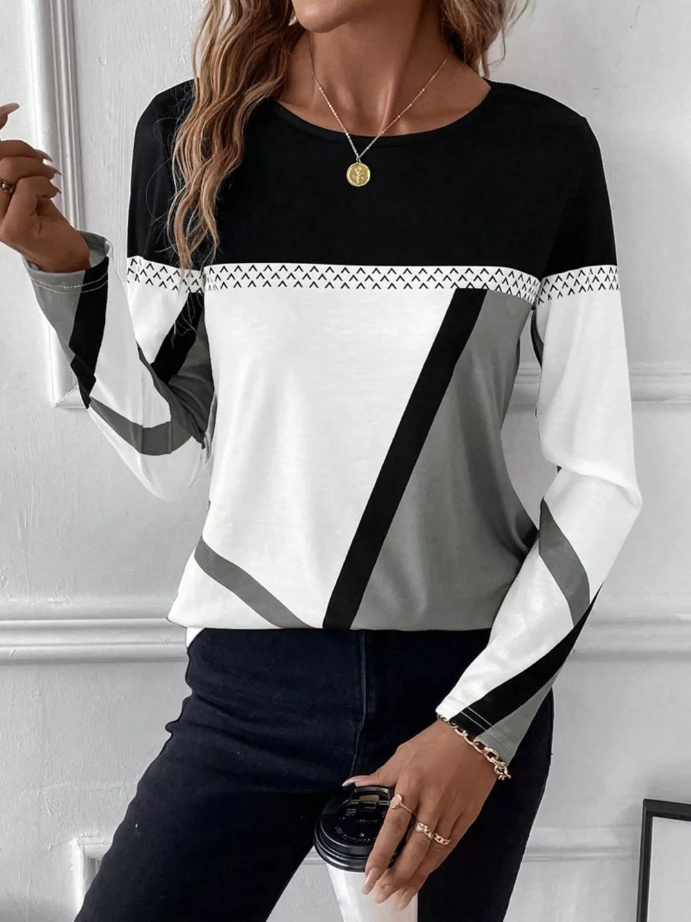 Geometric panel long sleeve t-shirt in black, white, and gray with chevron detail