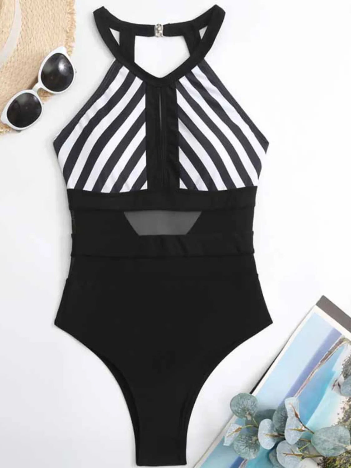 Black and white striped halterneck mesh swimsuit with keyhole detail and backless design.