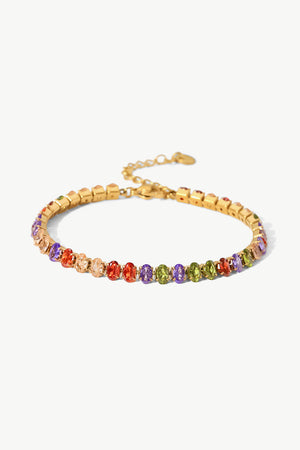 18K gold plated tennis bracelet with multi-colored oval cubic zirconia stones.