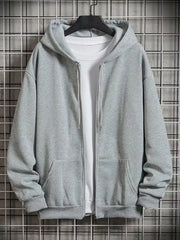 Gray zip-up hoodie with drawstring hood and front pockets, layered over a white t-shirt.