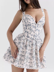 Mini dress with sweetheart neckline, floral print, and lace trim.