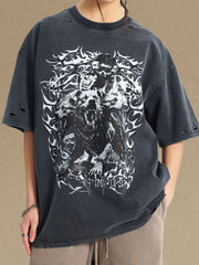 Black oversized graphic tee with distressed details and wolf artwork.