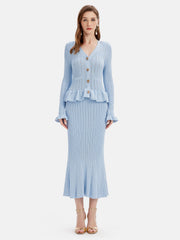 Light blue knit cardigan set with ruffled hem and flared skirt.