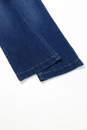 Medium wash denim wide leg jeans with visible stitching detail on the hem.