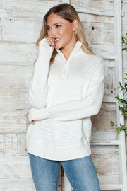 White ribbed knit pullover sweater with funnel neck and quarter zip, long sleeves.