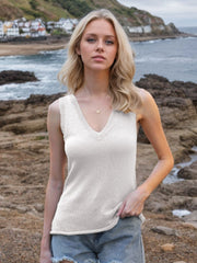 White knit tank top with deep V-neck and subtle texture