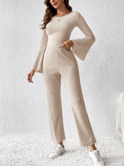 Cream ribbed knit co-ord set with bell sleeves and wide leg pants.