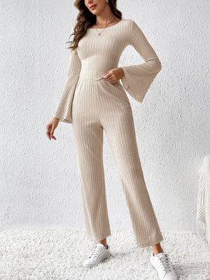 Cream ribbed knit co-ord set with bell sleeves and wide leg pants.