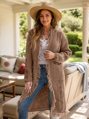 Textured fringe maxi cardigan in camel with open front and pockets.