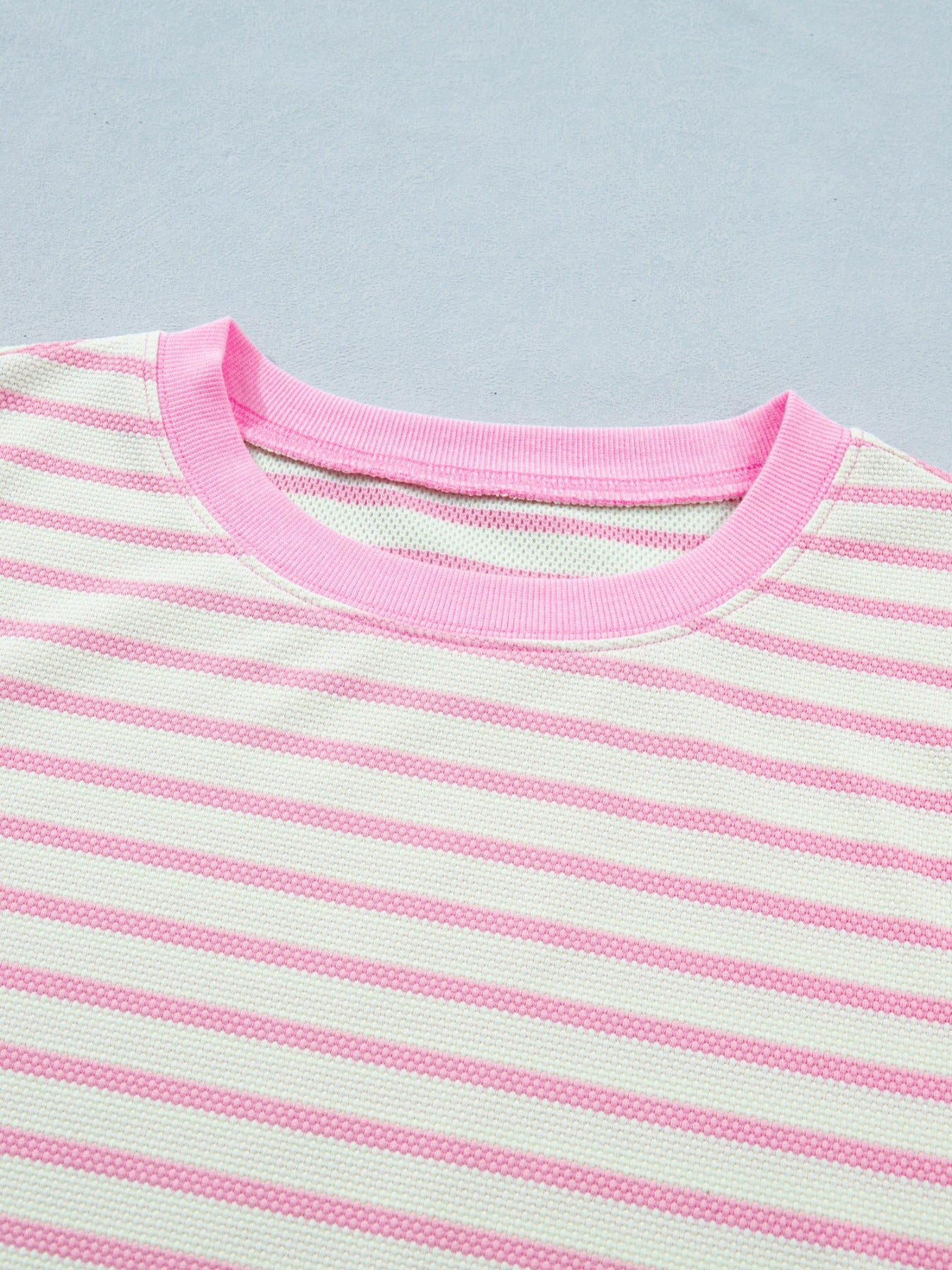 Striped cotton blouse with pink crew neck and trim