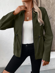 Army green utility jacket with cinched waistline and black trim.