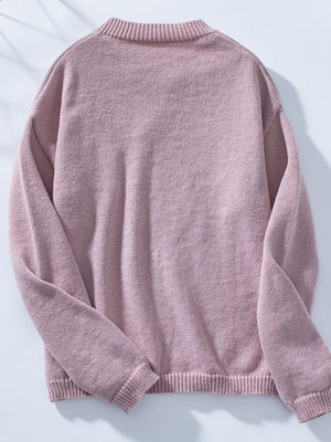 Dusty pink knit sweater with notched neckline and ribbed cuffs and hem.