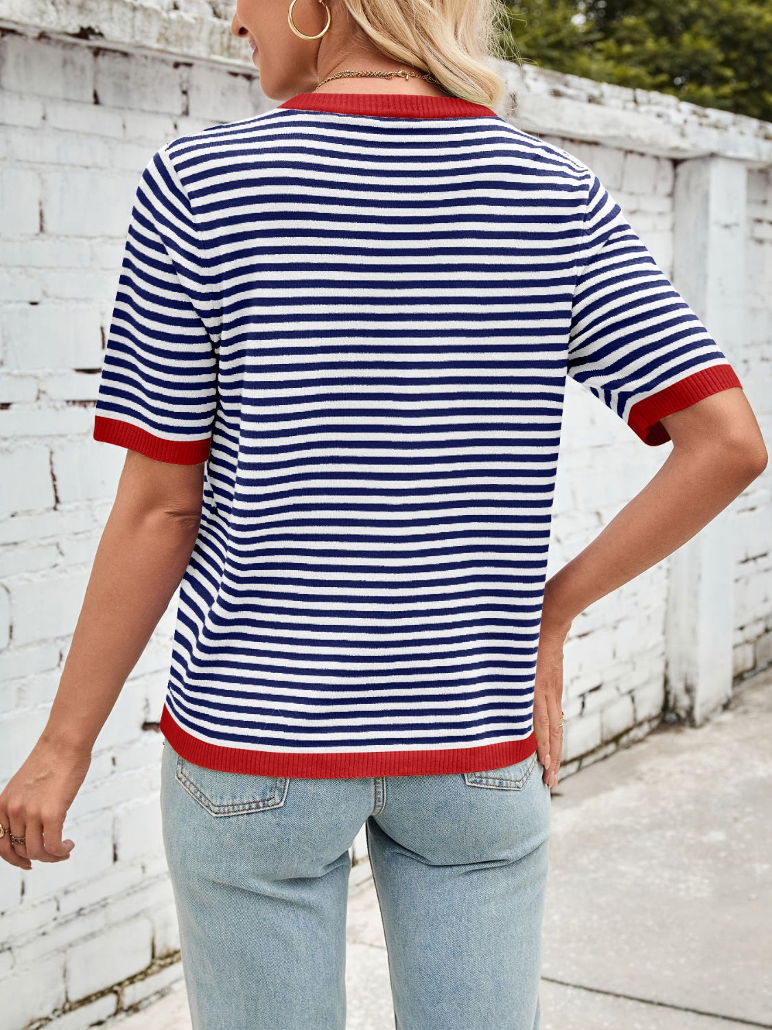 Nautical striped knit tee with red trim and short sleeves.