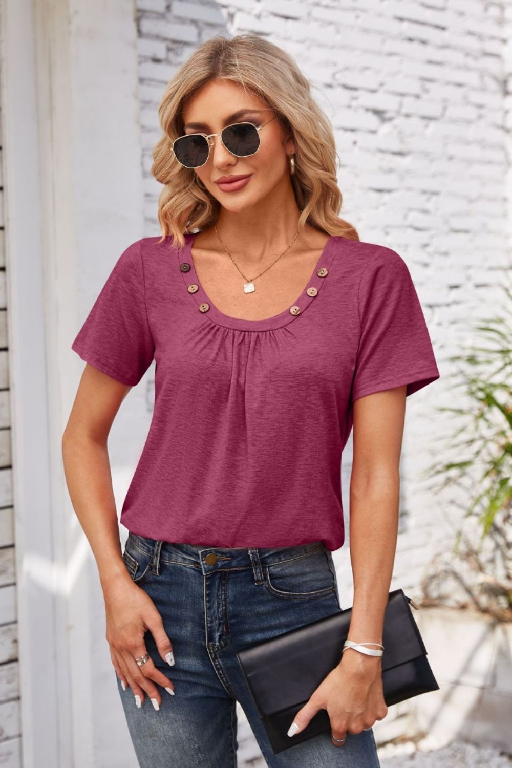 Button-trimmed gathered yoke top in watermelon pink with short sleeves and a scoop neckline.