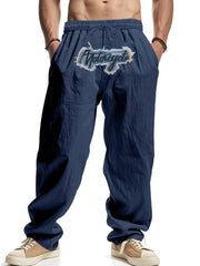 Navy blue men's sweatpants with drawstring and motorcycle graphic detail.