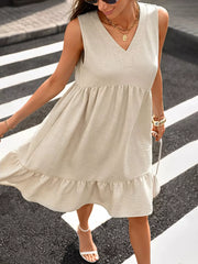 Effortless V-neck ruffle hem dress in khaki with a tiered skirt and textured fabric.