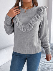 Gray textured knit sweater with ruffle yoke detail and crew neck.