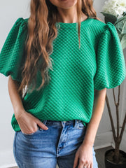 Diamond quilted puff sleeve top in turquoise with a crew neck.