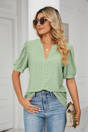 Sage perforated puff sleeve keyhole blouse with a v-neckline.