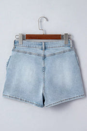 Light wash denim shorts with button fly and bow detail on the side.