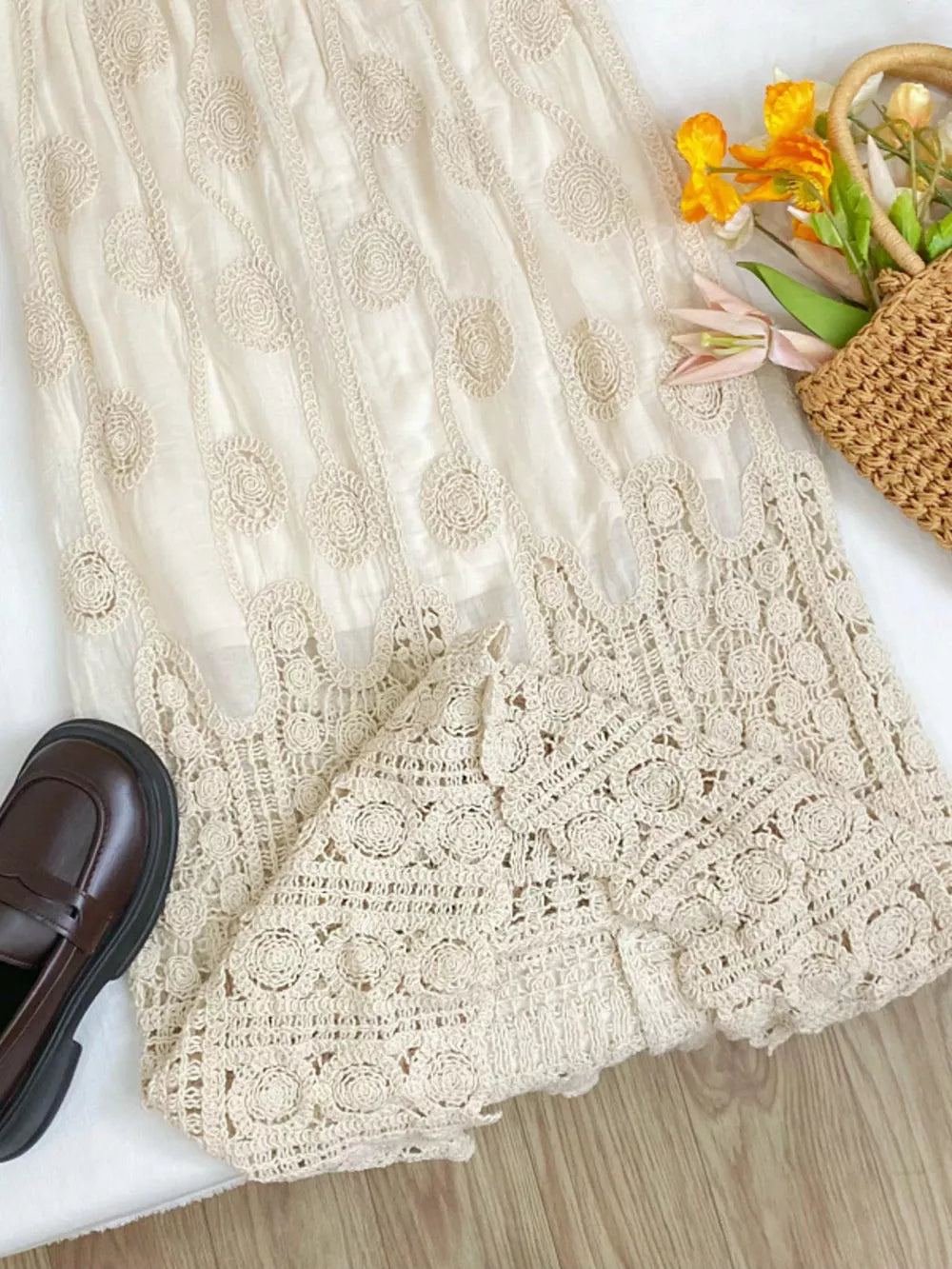 Luxe lace midi skirt in apricot with crochet circular pattern and elastic waist detail.