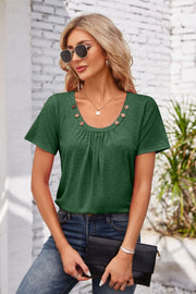 Dark green short sleeve top with gathered yoke and button trim neckline