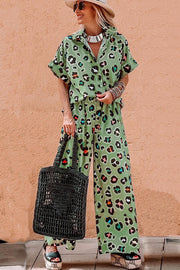 Leopard print resort shirt and wide-leg trousers set in sage green with colorful spots.