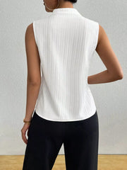 White textured sleeveless blouse with notched V-neck and vertical ribbing detail.