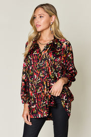 Silk ikat tie-neck blouse with button closure and abstract print