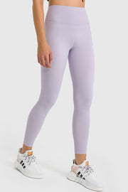 Lilac high-waist performance leggings with a seamless design and ankle length.