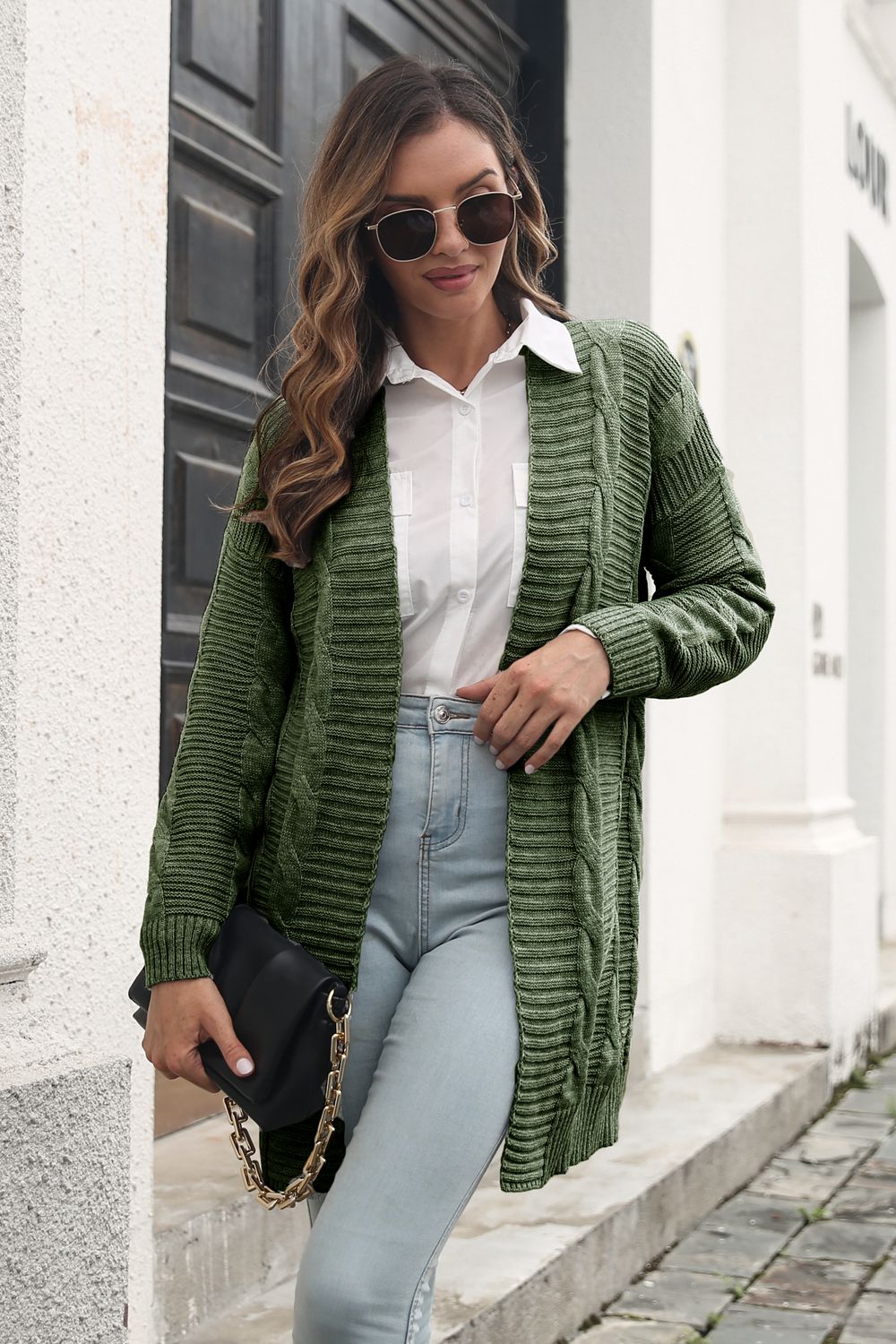 Longline army green cable knit acrylic cardigan with ribbed details and open front.