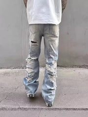 Light wash distressed wide leg jeans with heavy rips and a relaxed fit.