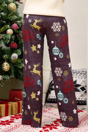 Wide-leg lounge trousers in dusty purple with festive Christmas print, reindeer, snowflakes, and ornaments.