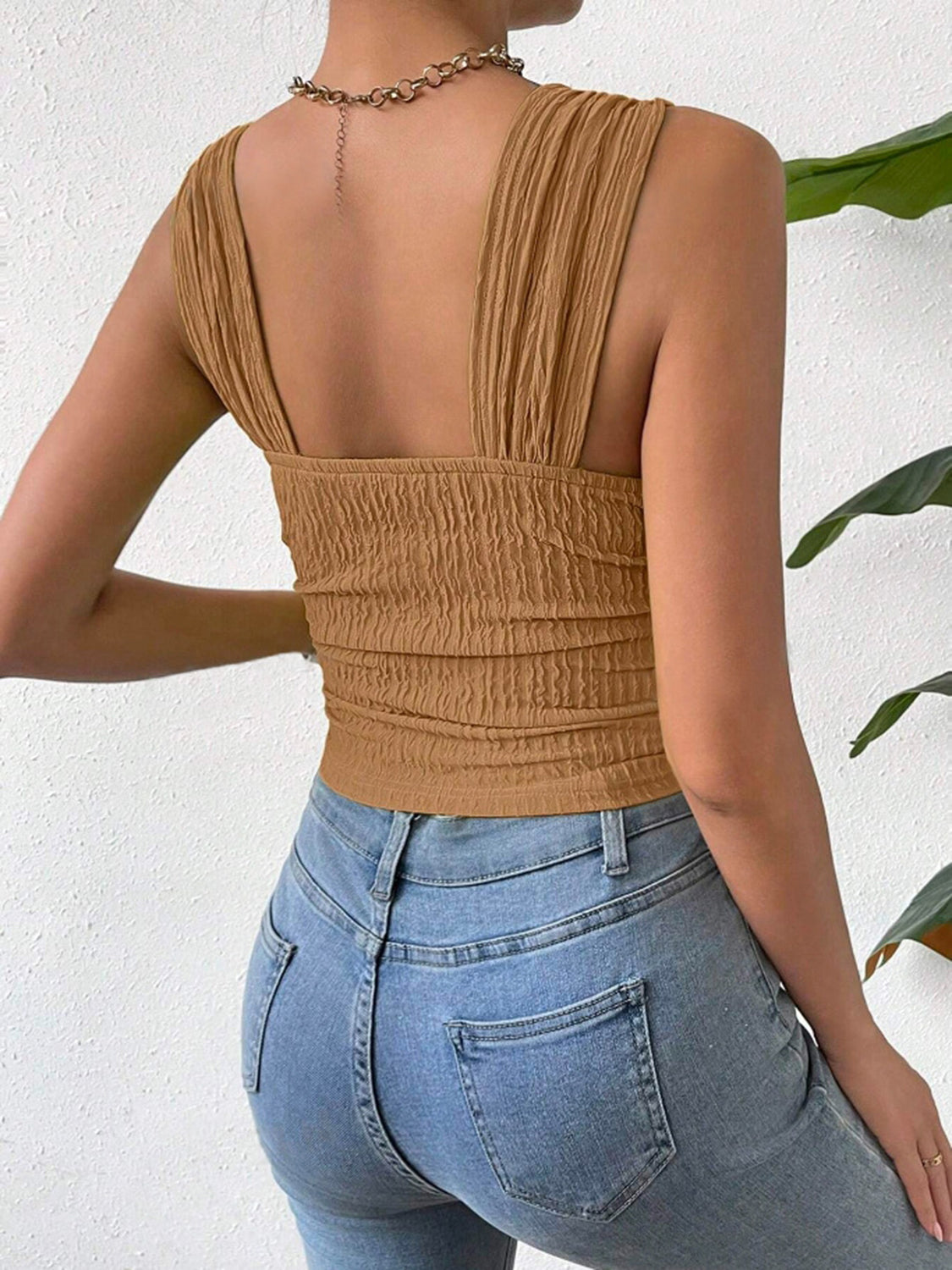 Textured crinkle strap crop top in camel with ruched detail.