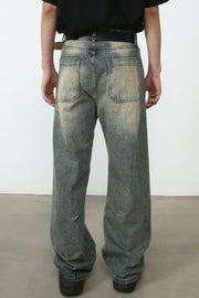Faded wash baggy carpenter jeans in medium, featuring a distressed look and relaxed fit.
