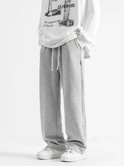Light gray casual loose fit sweatpants with drawstring and pockets.